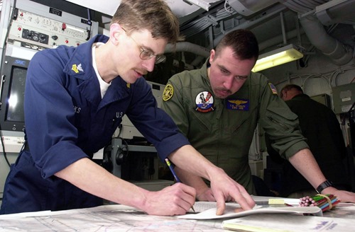 030115-N-1577S-002<br /><br />
ABOARD USS NIMITZ (CVN-68) January 15,2003<br /><br />
United States Naval Reservist Signalman 1st Class Chad Brooks of Port Orchard, Wash., conducts submarine water space management training with Aviation Warfare Systems Operator 2nd Class Charles Stanley of Wilmington, N.C,. aboard Nimitz. Nimitz is currently undergoing Composite Unit Training Exercise (COMPTUEX) off the coast of San Diego, Calif. U.S. Navy Photo by PHAA Timothy Sosa<br /><br />
