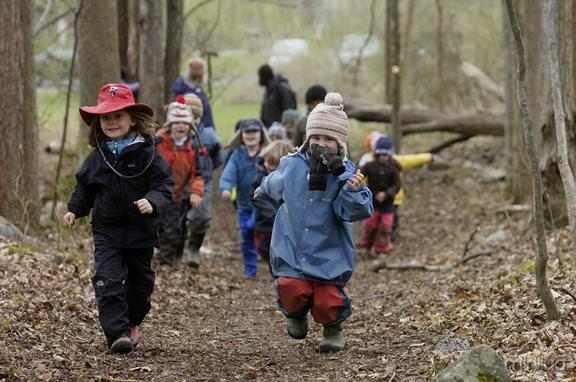 Waldorf School of Saratoga Springs Forest Kindergarten students bundled up in hats, coats, waterproof pants and boots enjoy the outdoors last week. Forest Kindergartners spend the entire school day in the woods, learning while they connect with nature. (ERICA MILLER/emiller@saratogian.com)