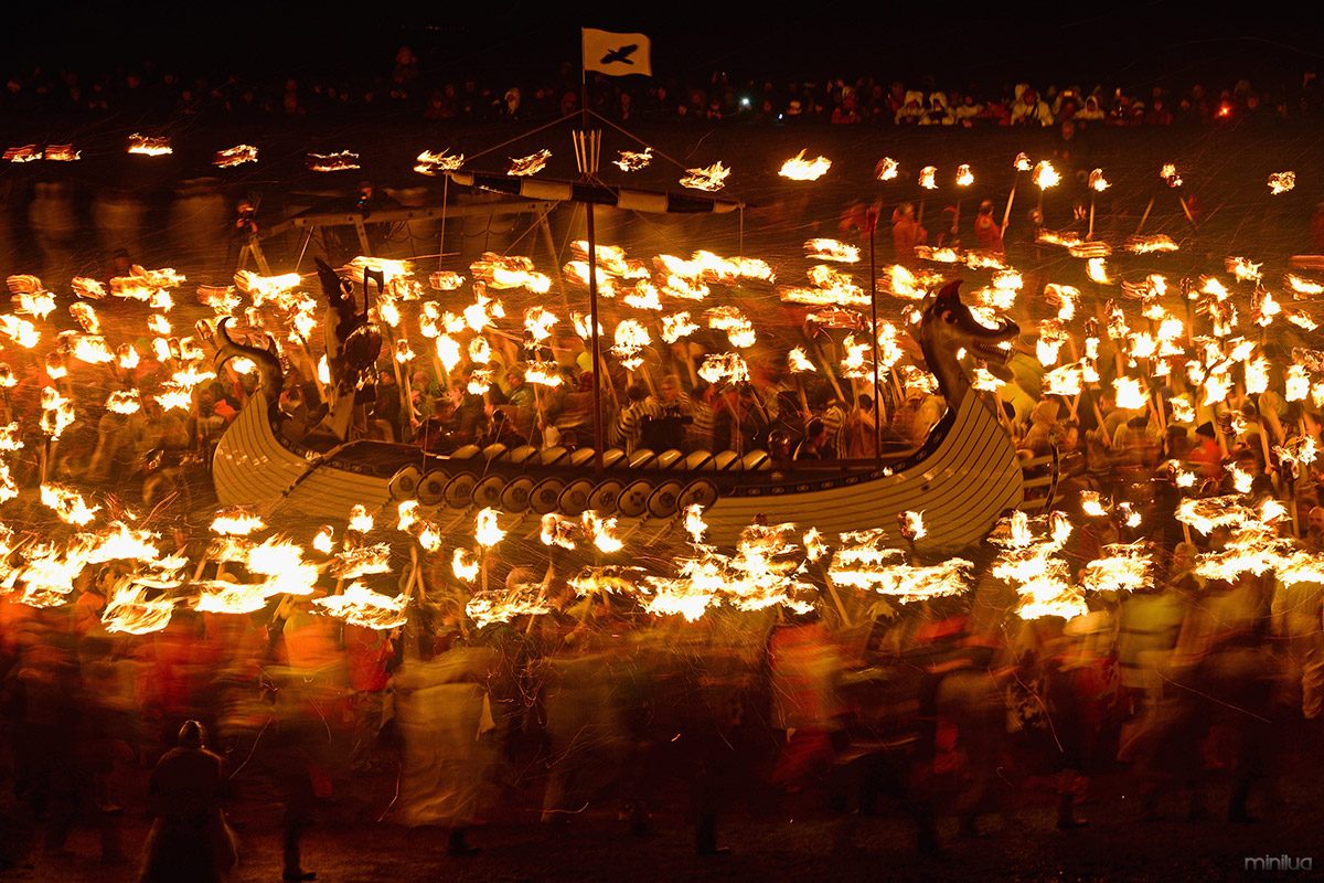 helly-aa-long-boat-torches-blur