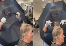 Cabeleireira corta buracos no guarda-chuva para braços e olhos como barreira entre clientes