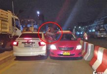 Motorista de táxi chuta outro motorista pela janela do carro