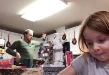 O pai dança alegremente no vídeo da filha - sem sabre que está sendo enviado ao professor
